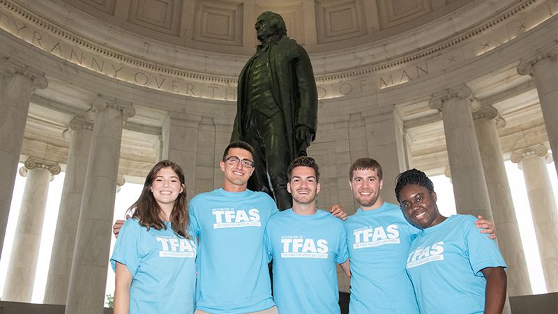 Students in front of statue of Thomas Jefferson.