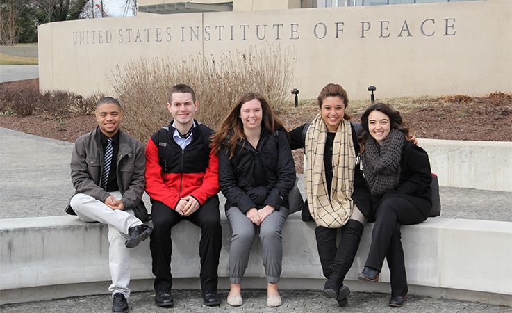 Studnets in front of the U.S. Institute of Peace.