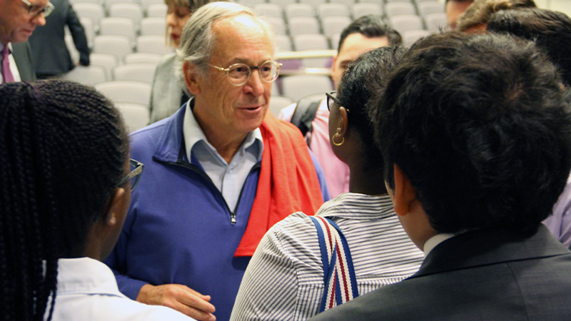 Jose Pinera of Chile, speaking to students after guest lecture.