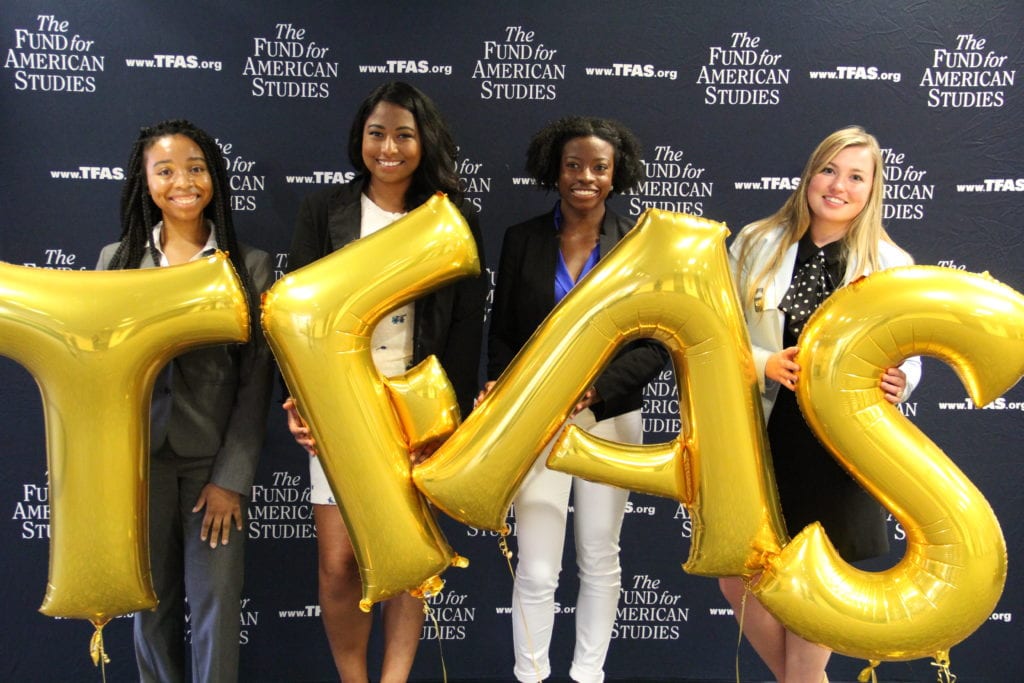 Students at the Alumni Round Table holding Balloon Letters