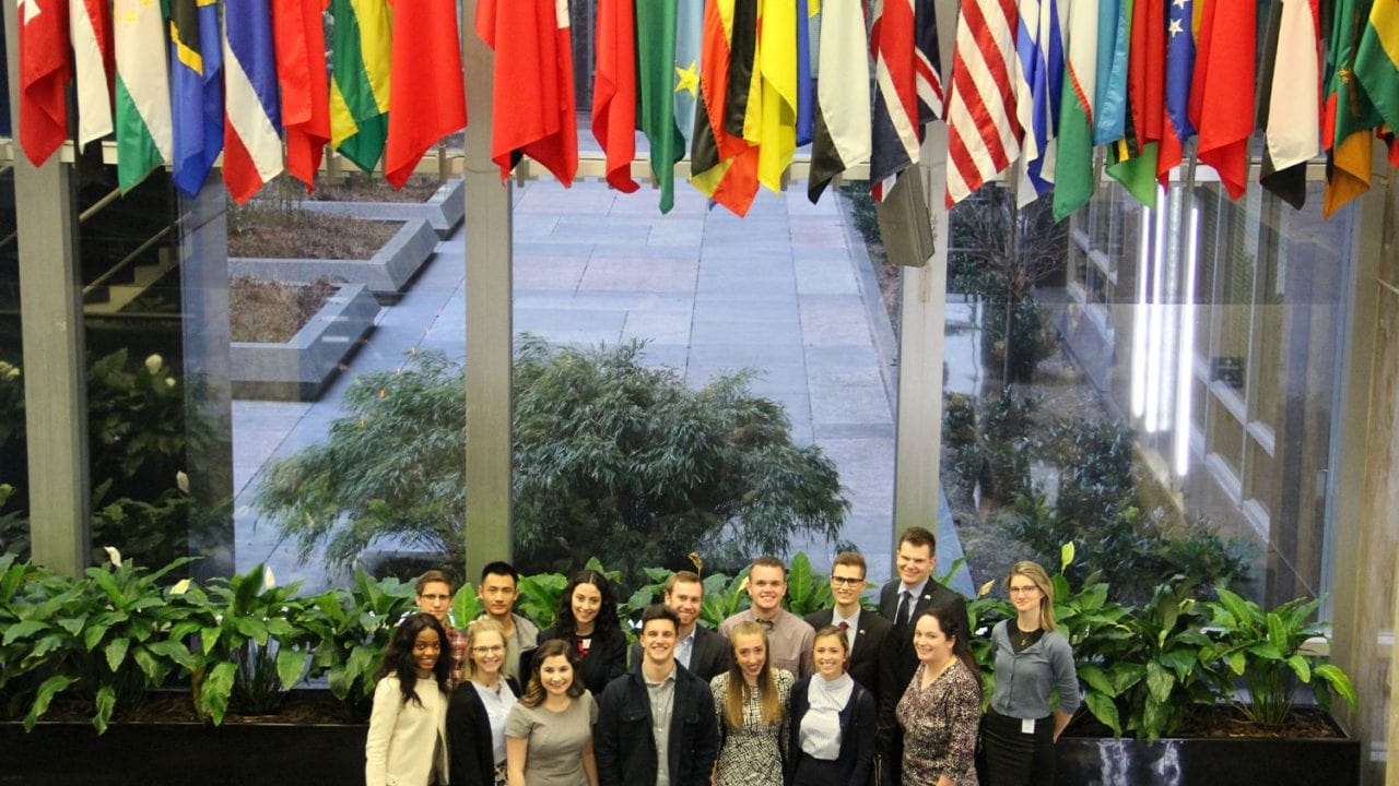 Students under flags from round the world.
