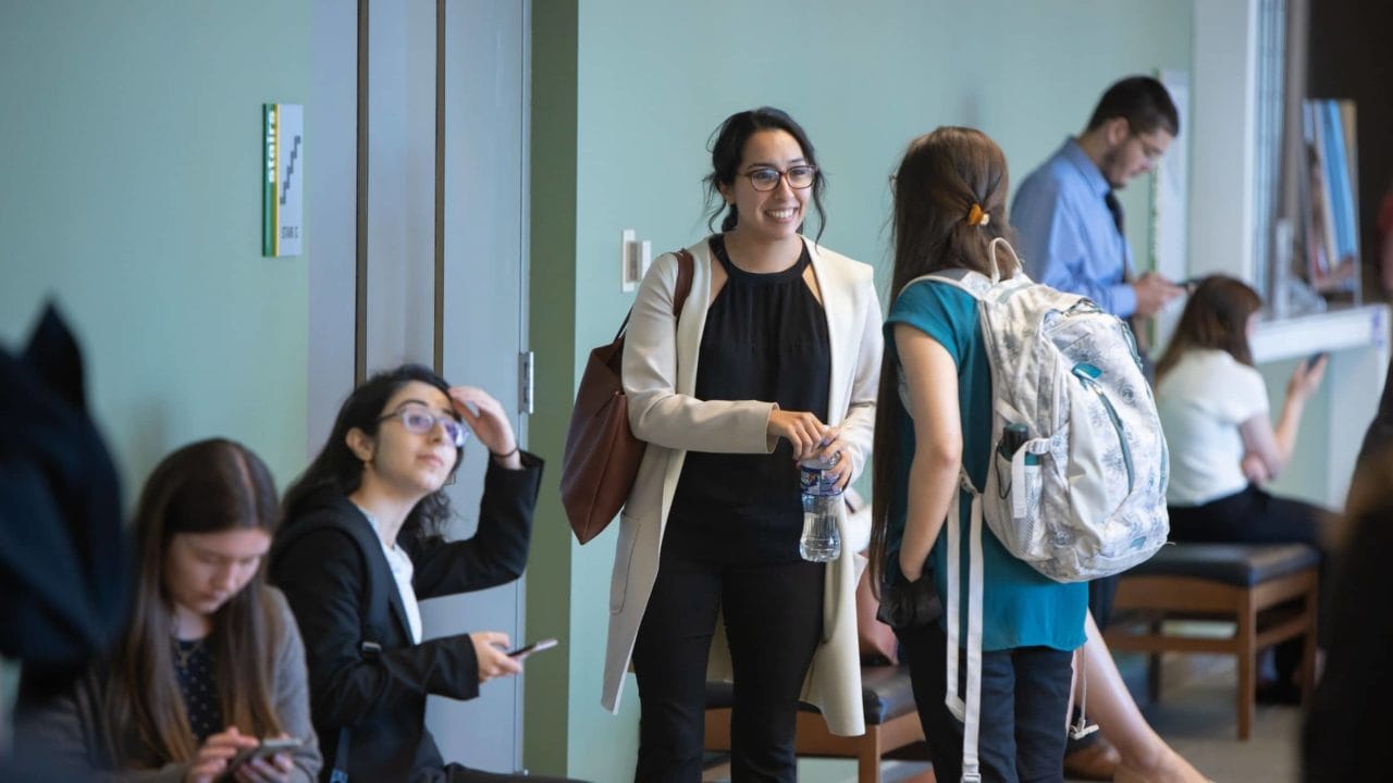 Student networking before class at GMU